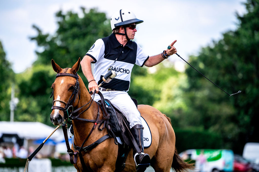 Gaucho polo player in branded kit competing at Ham Polo Club